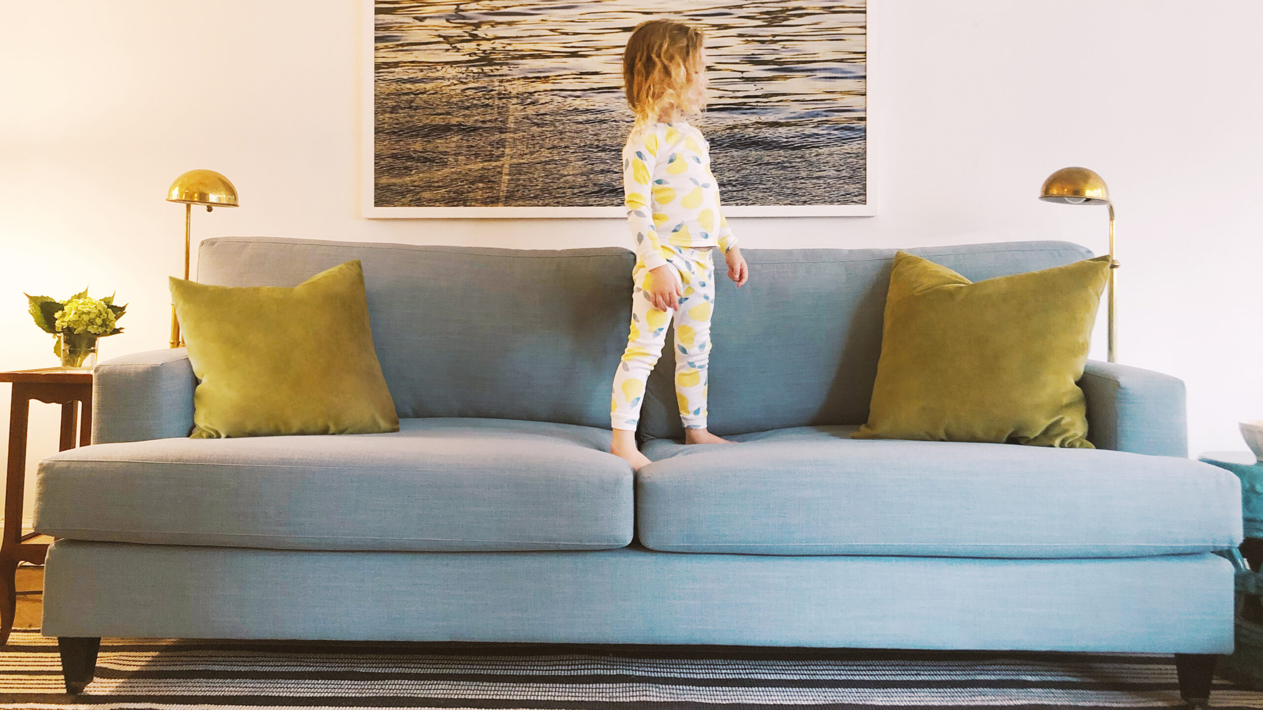 Classic Sofa by The Inside by Havenly Classic sofa in a living room with a child on the sofa